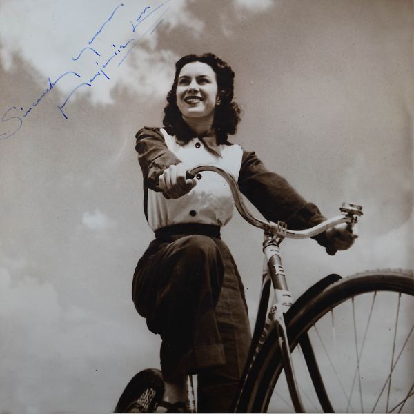File:Girl on a bike.jpg