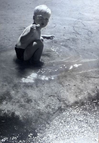 File:Child playing in water.jpg