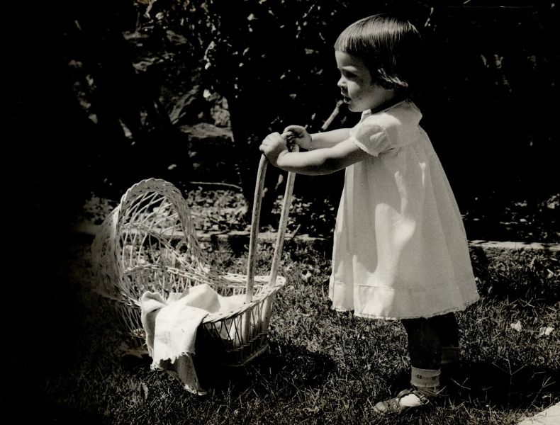 File:Baby with toy pram.jpg