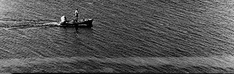 File:Unknown fisherman in boat.jpg